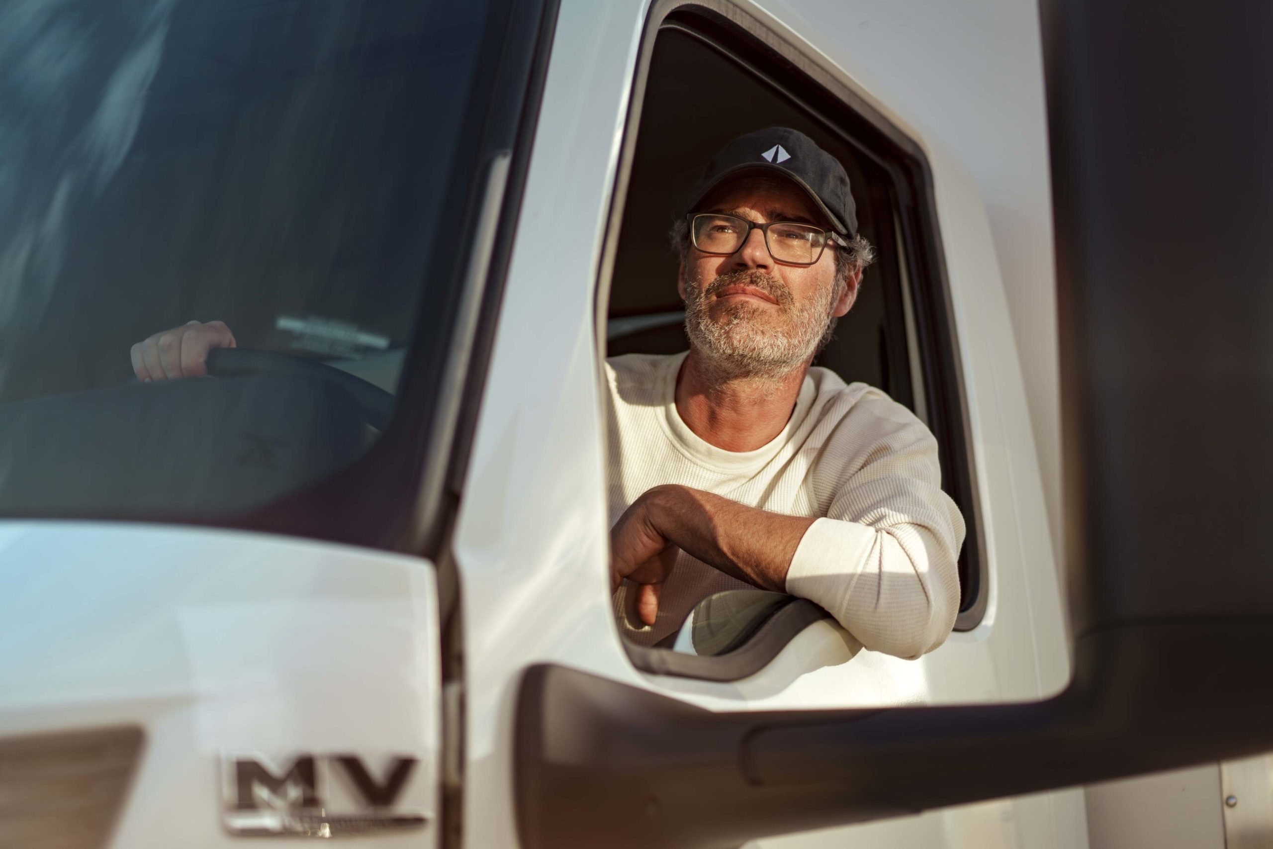 international-male-driver-close-up-in-cab-window-240318-9504
